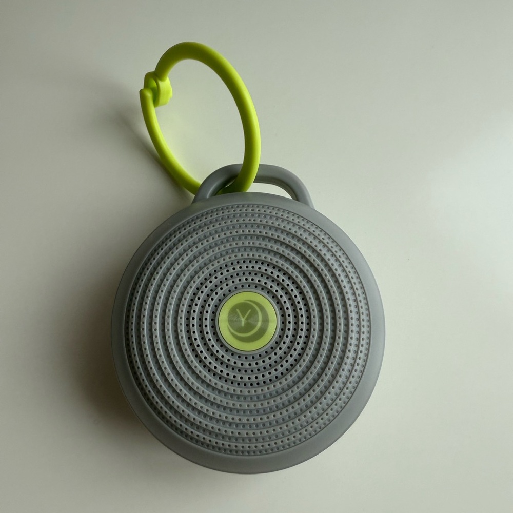 Compact Gray and Green Portable Speaker for Outdoor Use